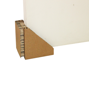 Honeycomb corner protector supporting the edge of a board.